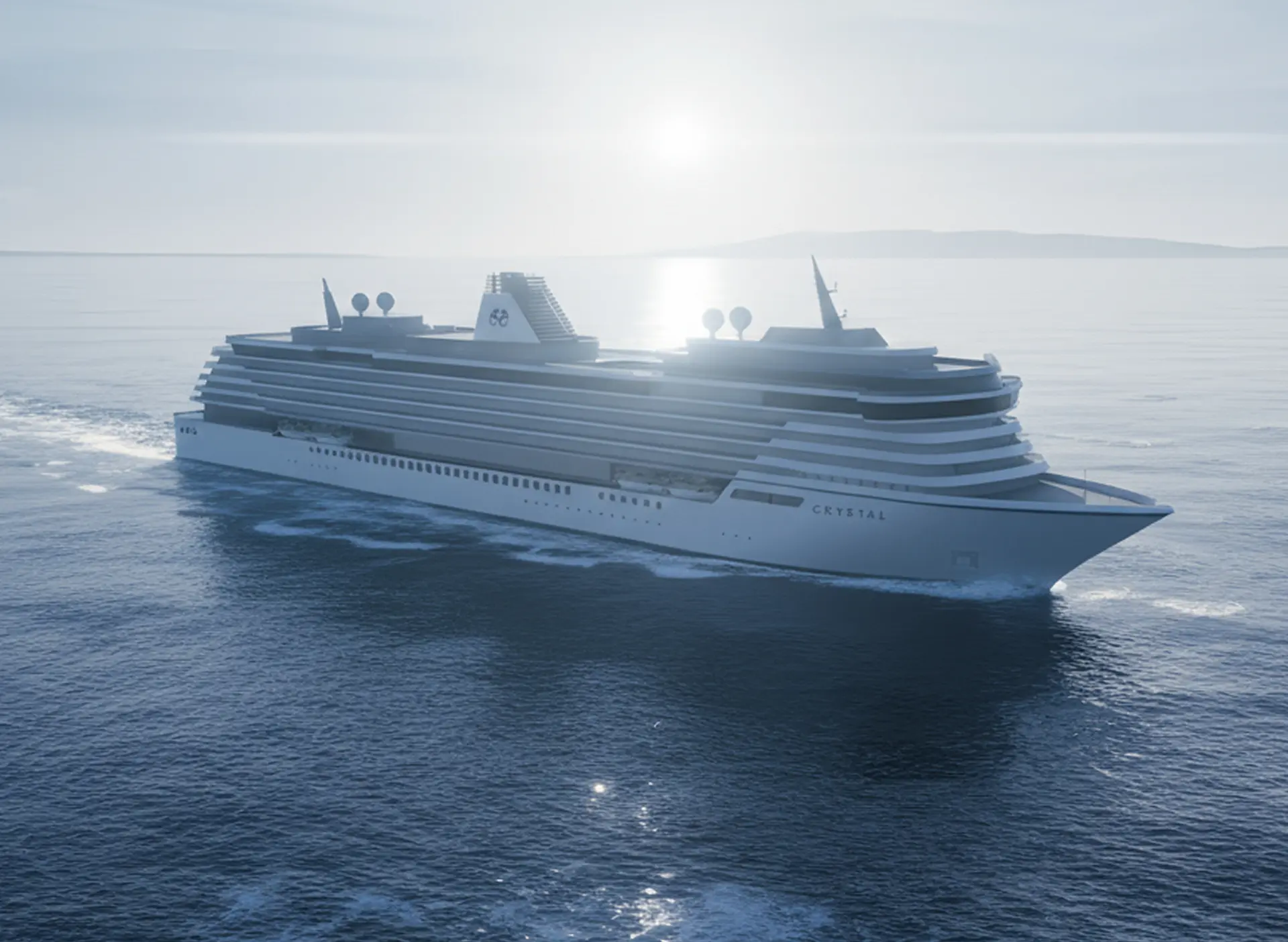 48a48d4b3ea65f57270567f572cb0d690b877b19-3456×2528-1 Crystal Serenity cruise ship sailing across calm blue waters under overcast skies, displaying elegant tiered deck architecture and dual funnels.
