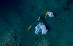 Aerial View of Tropical Island Paradise An breathtaking aerial perspective of a pristine tropical island surrounded by crystal-clear