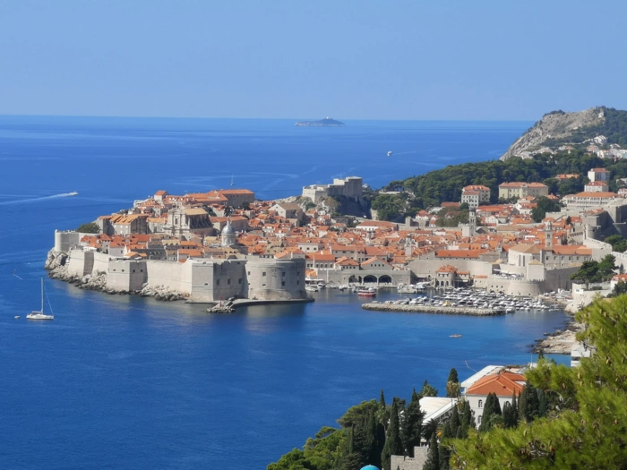 Dubrovnik Old Town Aerial Coastal View A stunning aerial photograph of Dubrovnik's iconic walled Old Town surrounded by brilliant