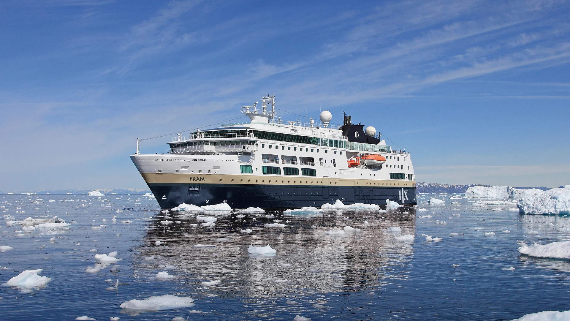 Expedition Cruise Ship in Arctic Ice Fields The expedition cruise ship Fram navigating through icy waters surrounded by floating ice fragments