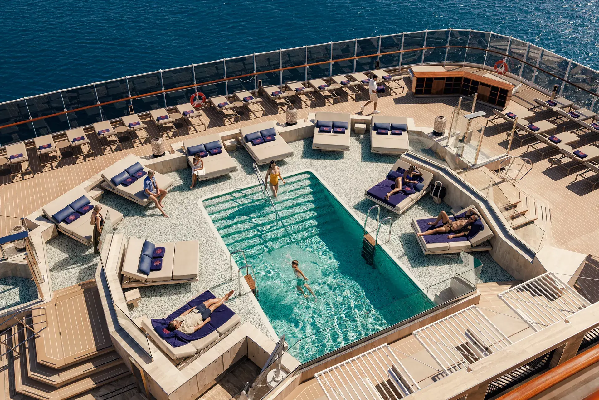 Explora_Atoll_Pool_0122_MASTER Explora Journeys Atoll Pool with expansive outdoor deck and ocean views