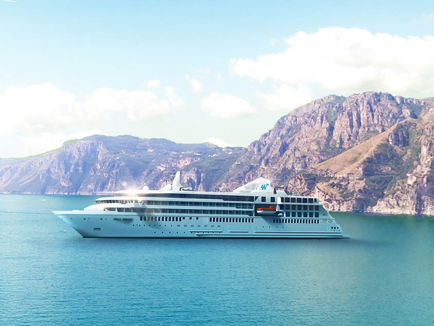 A sleek white cruise ship sailing through turquoise waters with dramatic rocky mountains in the background.