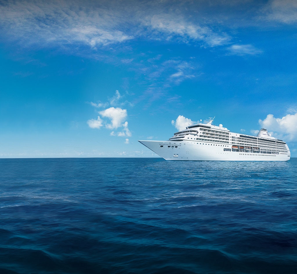 Luxury Cruise Ship on Blue Ocean A pristine white cruise ship sailing on deep blue waters under a clear sky with scattered white clouds. The vessel appears large and elegant, representing modern maritime travel.