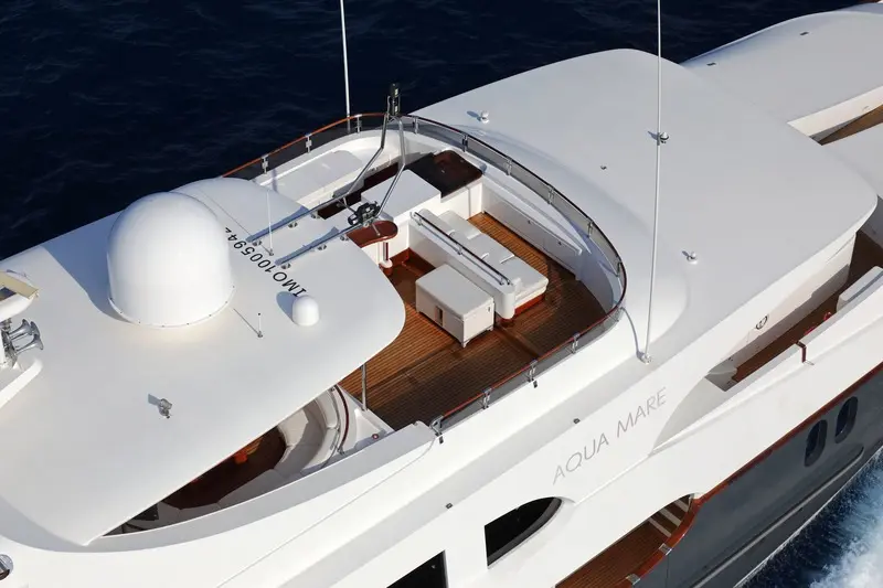 Luxury Motor Yacht Aqua Mare Deck An aerial view of the Aqua Mare, a luxury motor yacht featuring an elegant sun deck with white