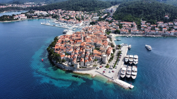 Rovinj Harbor with Cruise Ships An aerial view of the historic coastal town of Rovinj, Croatia, featuring a densely packed medieval