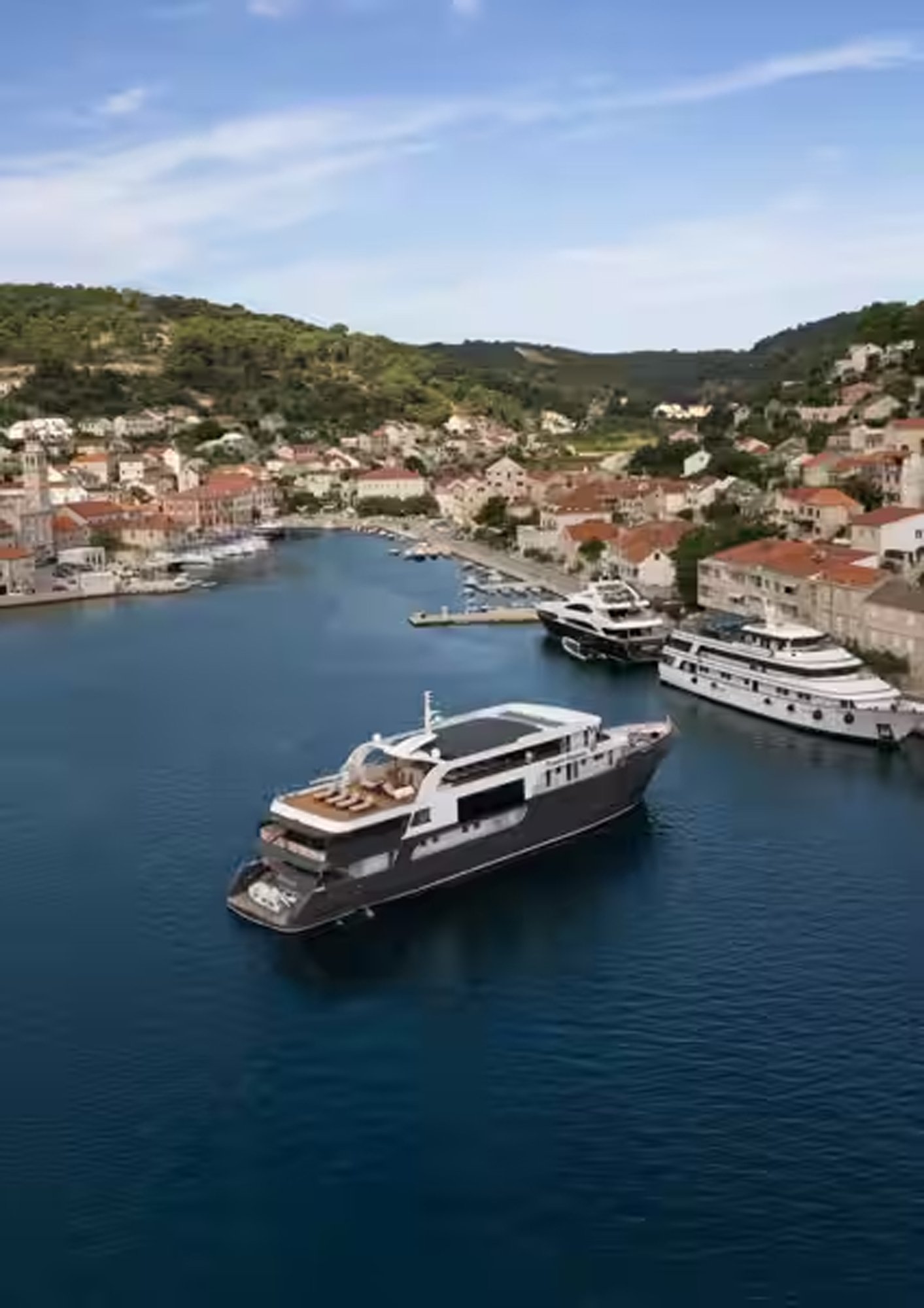 t-ship-princess-eleganza-drone-ship-in-brac-harbour Travelmarvel river cruise ship docked at a scenic European harbour with hills and traditional architecture in the background