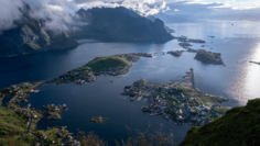 Arctic Fjord Archipelago Aerial View An aerial perspective of a stunning Arctic fjord landscape featuring deep blue waters dotted