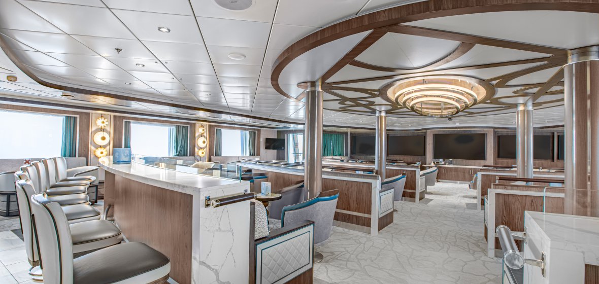 Luxury Cruise Ship Lecture Room with Modern Design An elegant and spacious lecture room or lounge aboard a luxury cruise ship, featuring curved wood