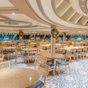 Modern Cruise Ship Lido Dining Area A spacious and elegantly designed lido dining area aboard a cruise ship, featuring multiple round