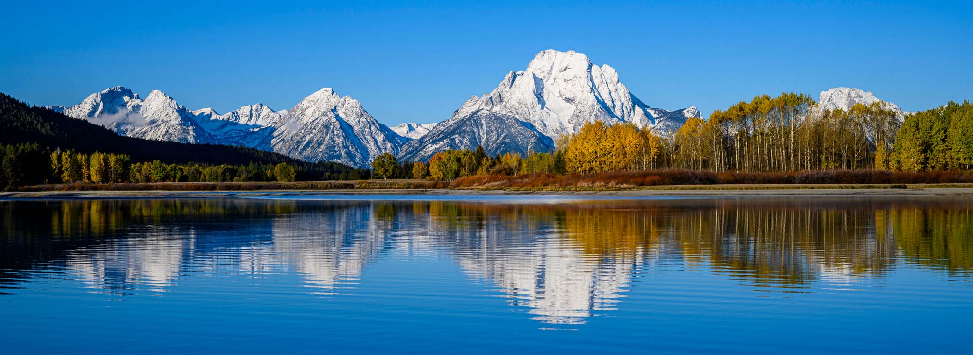 Oxbow Bend Mountain Lake Reflection A stunning panoramic view of Oxbow Bend in Grand Teton National Park, featuring snow-capped