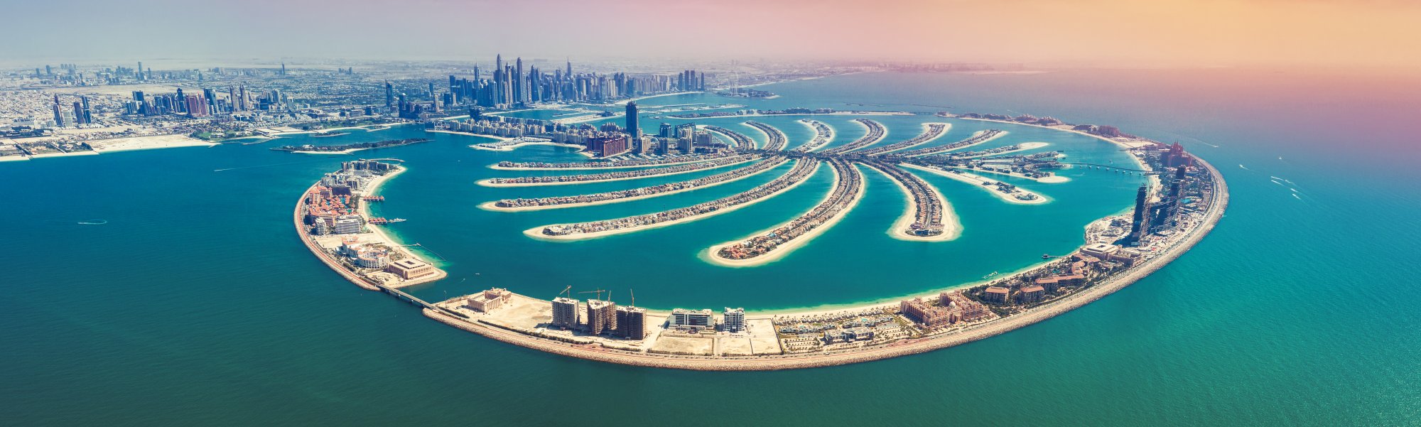 An aerial panoramic view of Palm Jumeirah, the iconic artificial palm-shaped island development in Dubai, United Arab Emirates.