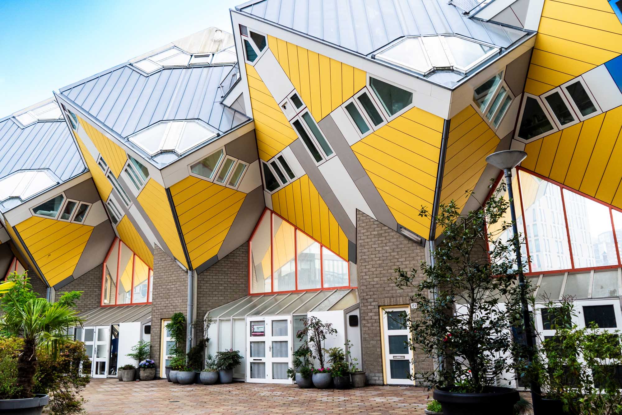 Yellow Cube Houses in Rotterdam A striking architectural view of Rotterdam's iconic yellow Cube Houses (Kubuswoningen), featuring